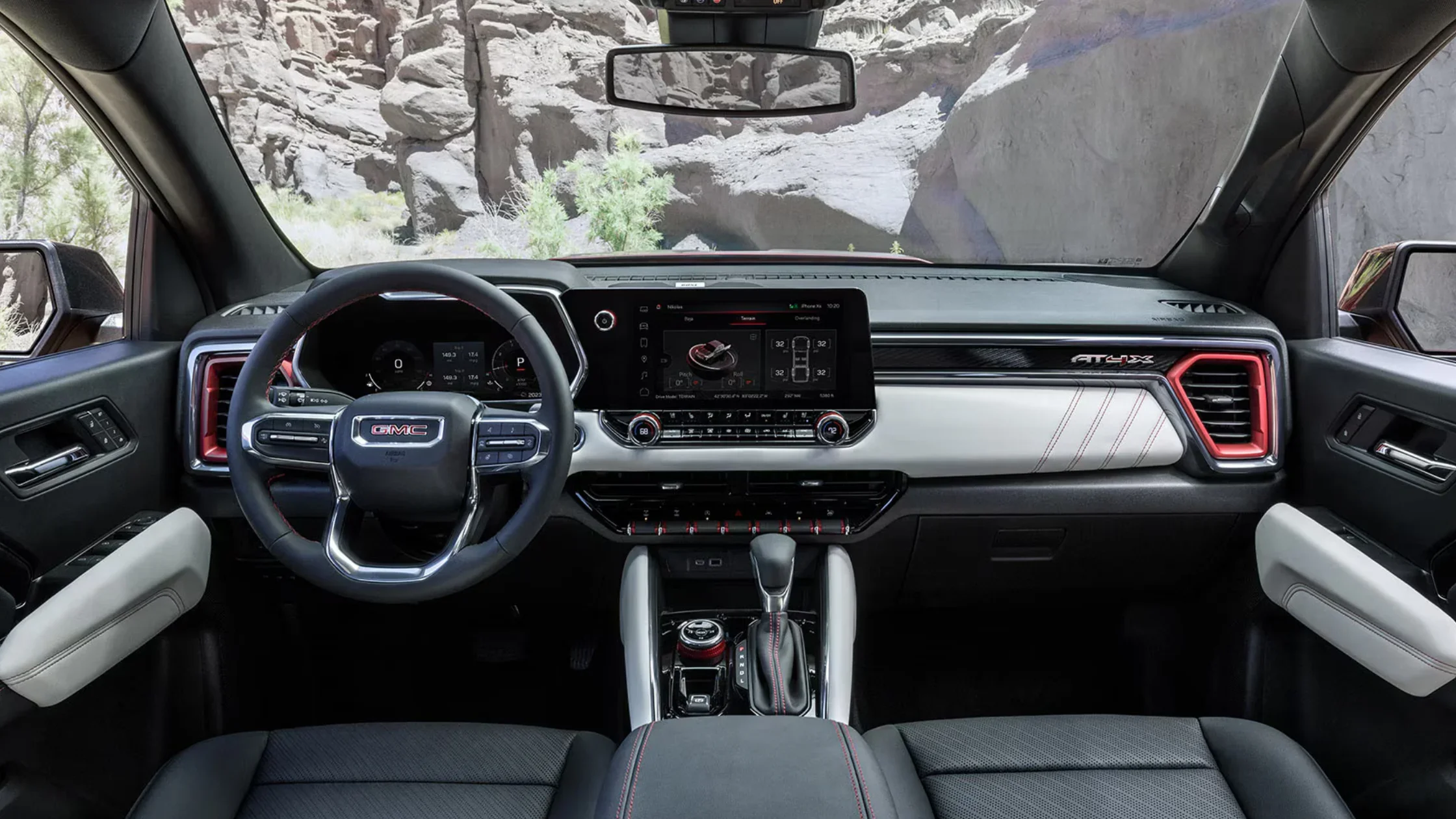 2025 GMC Canyon AT4X interior showcasing off-road drive modes on touchscreen display