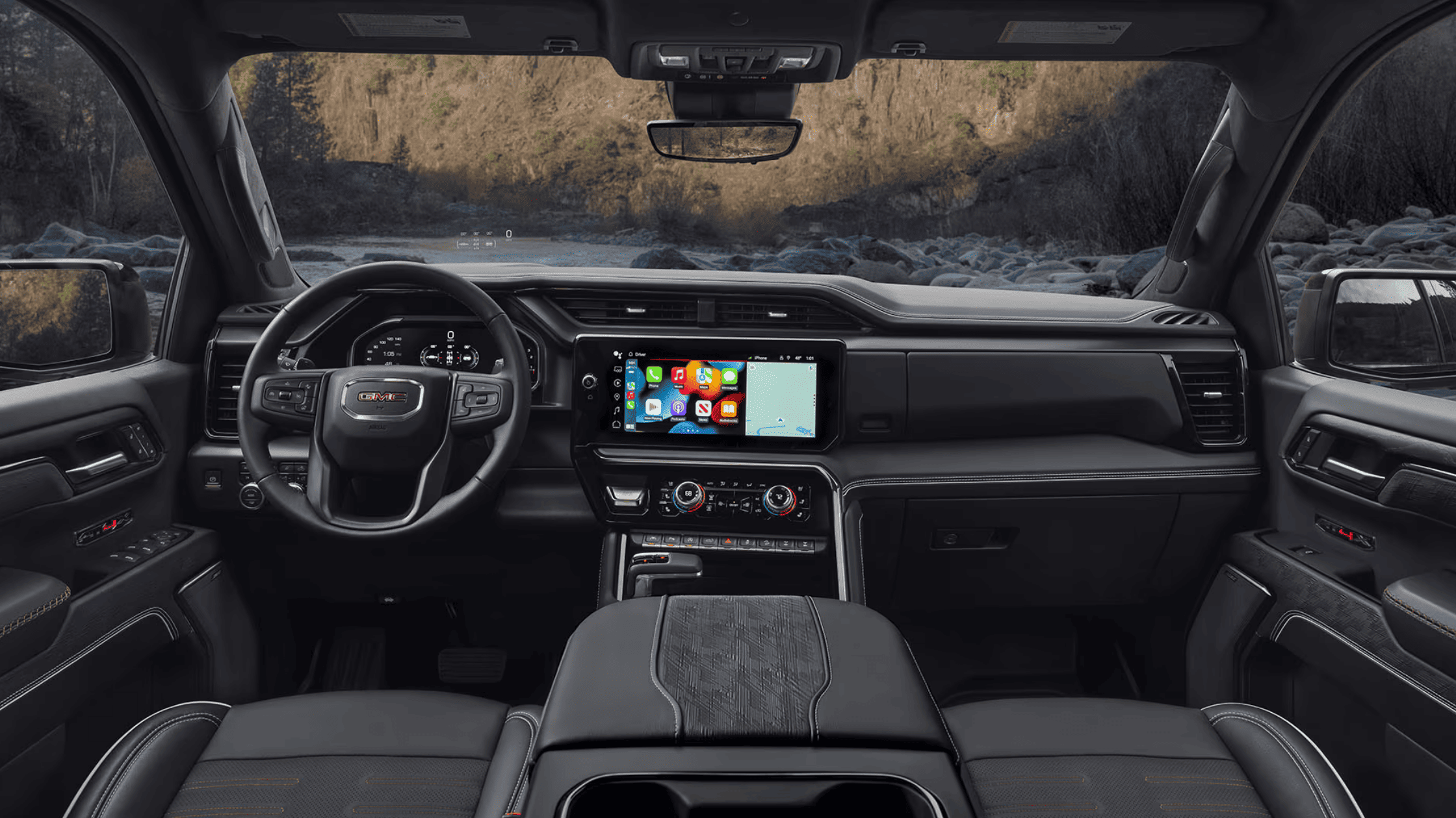 2025 GMC Sierra 1500 cabin featuring digital displays, premium steering wheel, and infotainment screen.